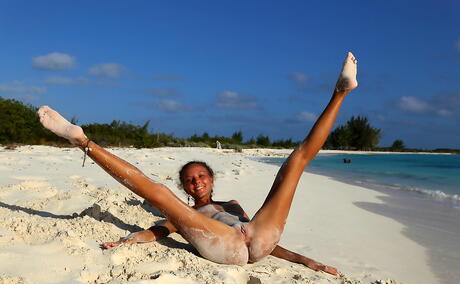 Rangy teen Katya Clover exhibits her butt and spreads her legs on the beach